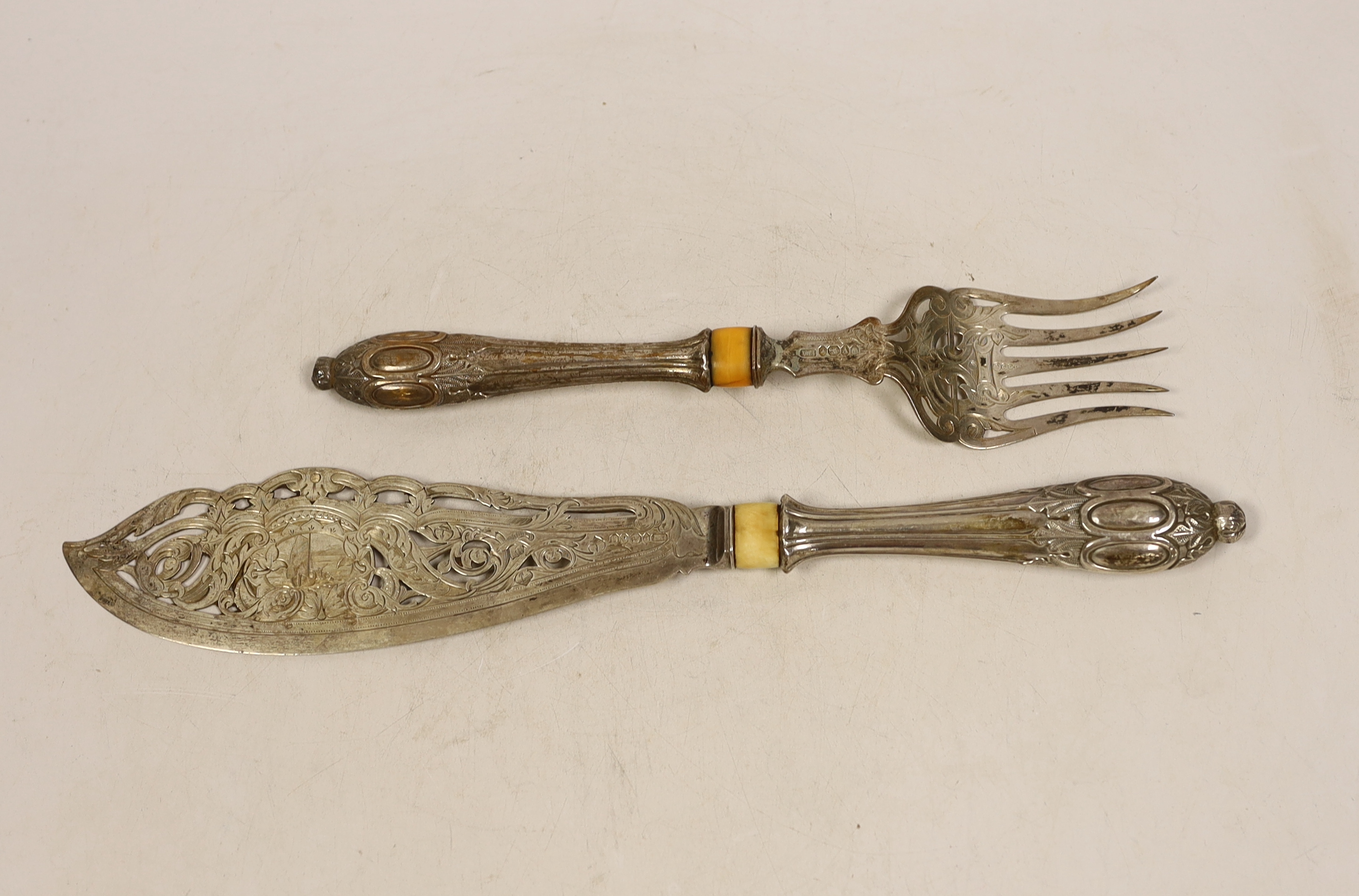 A pair of Victorian silver fish servers engraved and pierced decoration and silver handles (filled), Atkin Brothers, Sheffield 1863, knife 34.4cm. CITES Submission reference Z5185TNK